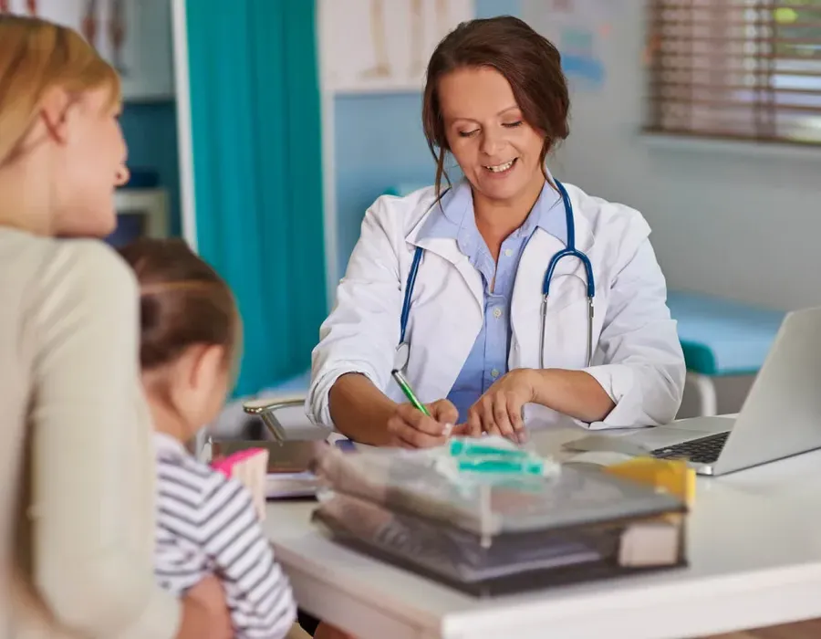 Pediatric Primary Care Nurse Practitioner Diagnosing Child Patient